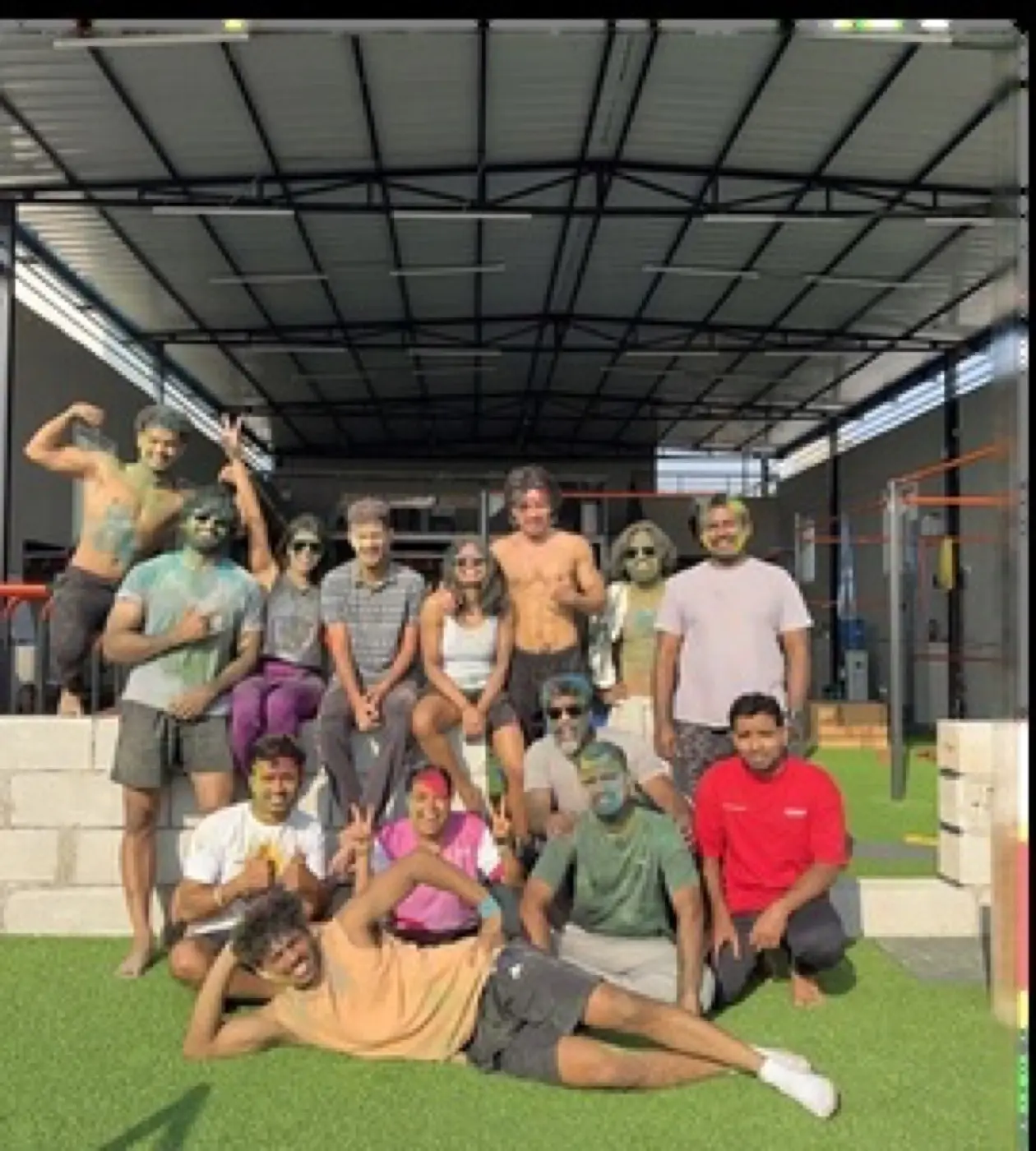 Members celebrating Holi together after a training session
